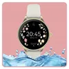 A smartwatch with a floral watch face is shown against a pink background with water splashing at the bottom. Podgląd zdjęcia produktu