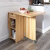 A wooden kitchen island with a drop-leaf table and shelves, set against a wall with floral wallpaper and a white wainscoting. Voir les images du produit