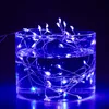 A glass container filled with water and illuminated by blue LED string lights. Produktbild-Vorschau