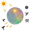 The image shows a holographic disc reflecting sunlight, with arrows indicating the sun's rays hitting it. Silhouettes of hummingbirds are shown near the disc, with arrows pointing towards them. Icons for a circle, a hummingbird, and a hammer and wrench are Náhľad obrázku produktu