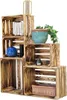 A set of wooden crates stacked in a pyramid shape, with various decorative items placed on and inside them. Anteprima dell’immagine prodotto