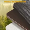 Close-up of three stacked wooden surfaces with different wood grain patterns, set against a blurred background of a forest. Anteprima dell’immagine prodotto