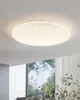 A flush mount ceiling light with a starry effect is shown mounted on a white ceiling. Produktbild-Vorschau