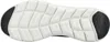 The underside of a black and white shoe. Voir les images du produit