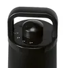 A close-up view of the top of a black heater, showing the control knob and handle. Produktbild-Vorschau