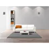 A modern living room with a white sofa, coffee table, bookshelf, and wall-mounted speakers. Produktbild-Vorschau