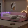A pink upholstered daybed with LED lighting in a bedroom setting. Náhled obrázku produktu
