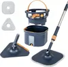 A flat lay of a mop and bucket cleaning system, with extra mop heads. Podgląd zdjęcia produktu