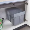 A built-in trash can with two compartments is shown inside a kitchen cabinet. Anteprima dell’immagine prodotto