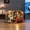 A miniature dollhouse room with furniture and lighting, set on a wooden table. Náhľad obrázku produktu