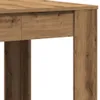 A close-up view of a wooden table leg and tabletop. Náhled obrázku produktu