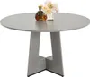 A round wooden dining table with a decorative bottle of alcohol, a glass, and a bouquet of flowers on top. Anteprima dell’immagine prodotto