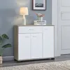 A modern entryway cabinet with a lamp and decorative items. Produktbild-Vorschau