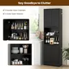 A black tall cabinet with various storage compartments, shown with interior contents and alongside a kitchen counter. Podgląd zdjęcia produktu