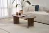 A living room scene with a coffee table, couch, and plant. Produktbild-Vorschau