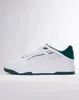 A side view of a white Puma sneaker with green accents. Produktbild-Vorschau