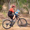 A person riding a mountain bike with a child in front. Náhled obrázku produktu
