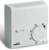 A white analog thermostat is shown against a white background. Voir les images du produit