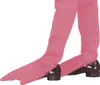 A close-up view of the lower legs and feet of a person wearing pink boot covers over black shoes. Podgląd zdjęcia produktu