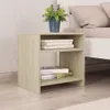 A wooden nightstand with two shelves, placed next to a bed. There is a potted plant on top of the nightstand. Náhled obrázku produktu