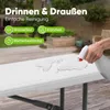 A hand spraying water onto a white plastic bench outdoors. Produktbild-Vorschau