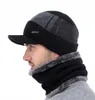 A man wearing a winter hat and scarf set. Produktbild-Vorschau