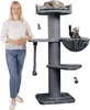 A woman stands next to a tall, multi-level cat tree with two cats on it. Produktbild-Vorschau