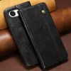 A black leather phone case is shown on a textured brown background. Produktbild-Vorschau