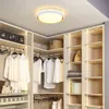 A modern closet with organized clothing and accessories, illuminated by a ceiling light. Podgląd zdjęcia produktu