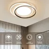 A modern LED ceiling light with a ring design is shown mounted on a ceiling, with curtains in the background. Below the light, there are four icons with text describing features. Náhľad obrázku produktu