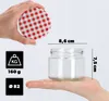 A hand holding a lid over a glass jar, with measurement indicators and weight/diameter icons. Anteprima dell’immagine prodotto