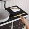A person is cleaning a bathroom vanity with a squeegee. Náhľad obrázku produktu