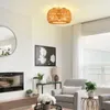 A living room scene featuring a rattan ceiling lamp. Anteprima dell’immagine prodotto
