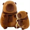 Two plush capybaras wearing scarves, one larger than the other, are shown against a white background. Podgląd zdjęcia produktu