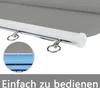 Close-up of a roller blind mechanism with rings for operation, and a magnified view of the fabric. Náhled obrázku produktu