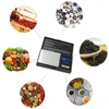 A digital scale surrounded by various items, suggesting its versatility for weighing different things. Produktbild-Vorschau