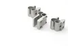 Several metal door hinges are arranged on a white background. Produktbild-Vorschau