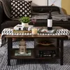 A coffee table with decorative items and books, placed in a living room setting. Voir les images du produit