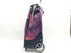A side view of a rolling shopping bag with a floral pattern. Voir les images du produit