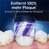 Close-up of a toothbrush head cleaning teeth, with marketing text overlay. Náhled obrázku produktu