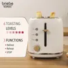 A white toaster with two slices of toast in it, placed on a wooden surface. To the left of the toaster, there is a white card with text and graphics describing the product's features. Produktbild-Vorschau