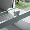 A close-up view of a shower enclosure's glass panel and metal frame, with a bathtub visible in the background. Produktbild-Vorschau