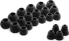 A collection of black silicone earbud tips of various sizes, arranged in rows on a white background. Voir les images du produit