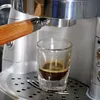 Close-up of an espresso shot being brewed into a glass. Náhľad obrázku produktu