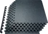 A stack of interlocking floor mats with a speckled black and blue surface. Produktbild-Vorschau