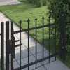 A black metal garden gate with spear-top finials is shown in a close-up view, adjacent to a paved walkway and a grassy lawn. Anteprima dell’immagine prodotto