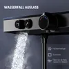 A close-up of a modern black shower faucet with water flowing out, showing temperature control and icons. Náhľad obrázku produktu