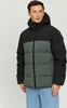 A man wearing a puffer jacket and jeans, posing against a plain background. Produktbild-Vorschau