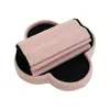 A pink storage ottoman with a black interior, shown from a slightly elevated angle against a white background. Podgląd zdjęcia produktu