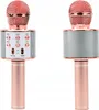 Two rose gold karaoke microphones are shown against a white background. The microphone on the left has a control panel with buttons and sliders. Podgląd zdjęcia produktu